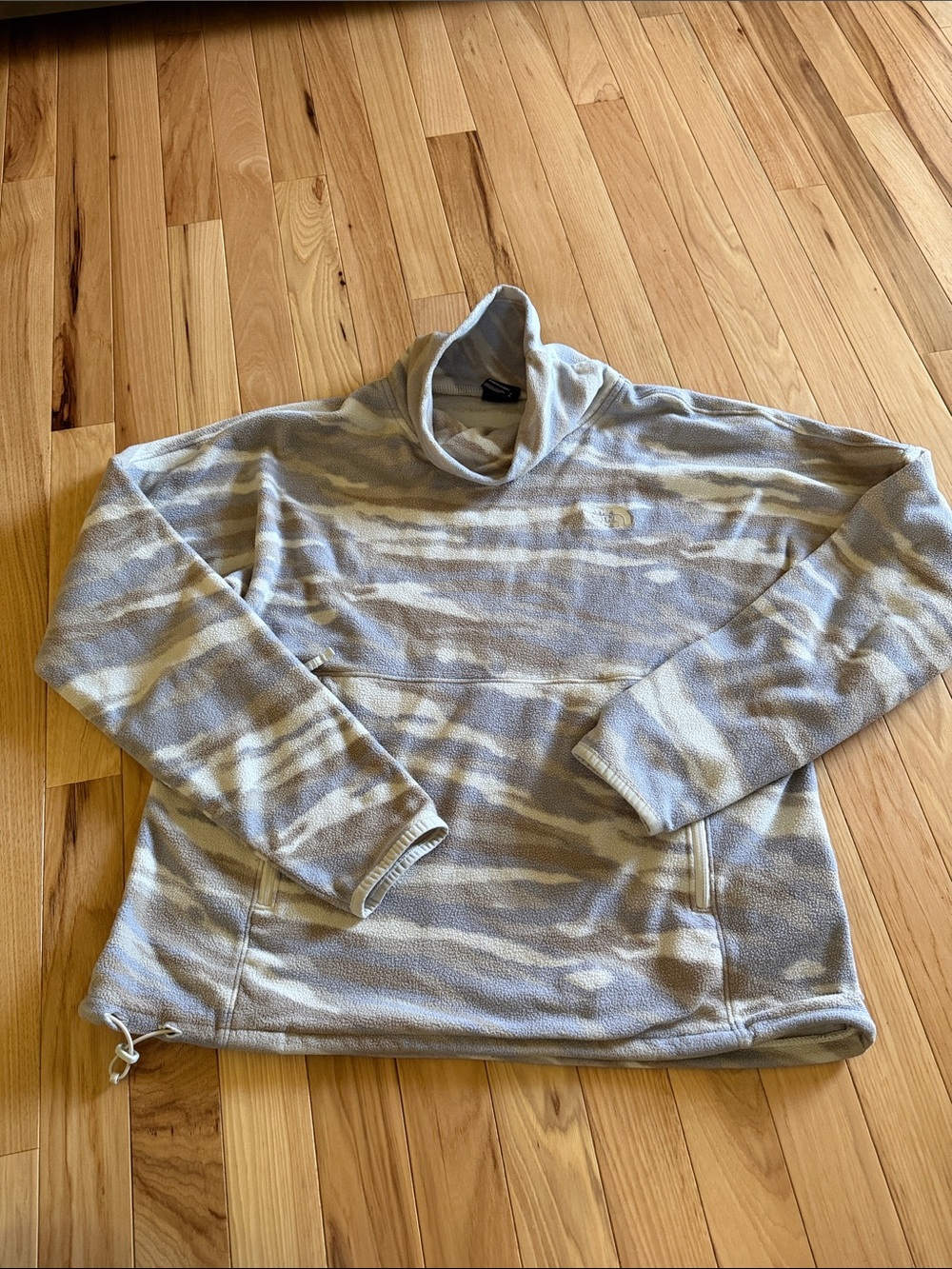 The North Face cream fleece jacket with black logo tag